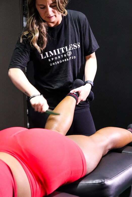 Graston Technique instrument-assisted soft tissue treatment being performed at Limitless Sports Chiropractic, the same manual therapy approach used to treat shoulder impingement and rotator cuff restrictions.